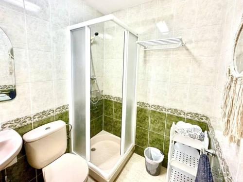 a bathroom with a shower and a toilet and a sink at Three bedroom apartment, PRIME Javea location in Jávea