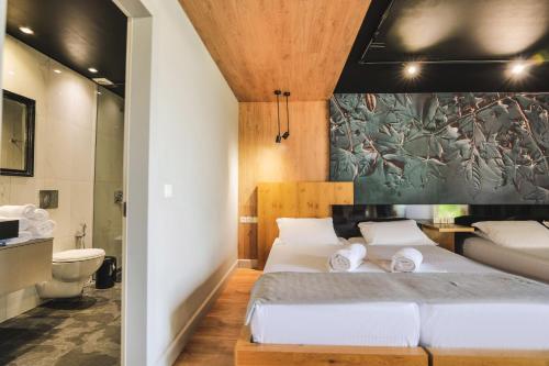 Postel nebo postele na pokoji v ubytování Porto Eda Hotel
