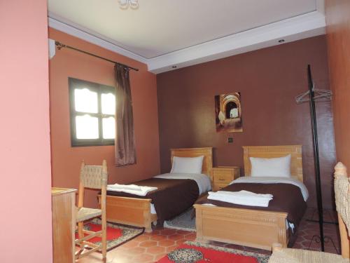 Un pat sau paturi într-o cameră la Auberge Kasbah Amoun