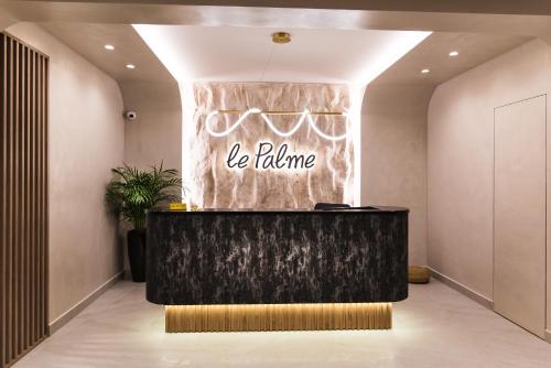 a lobby with a reception desk in a building at Le Palme in Malia