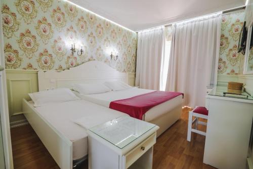 Porto Eda Hotelにあるベッド
