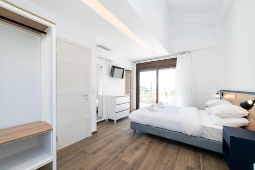 Ein Bett oder Betten in einem Zimmer der Unterkunft Argilos & Argilos Deluxe Residential Complexes