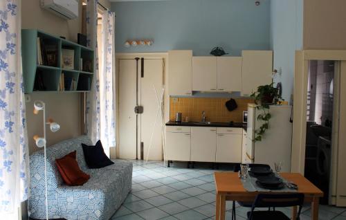 a living room with a couch and a kitchen at Casa Del Monte in Naples