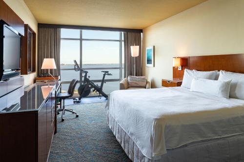a hotel room with a bed and a desk at The Westin Tampa Bay in Tampa