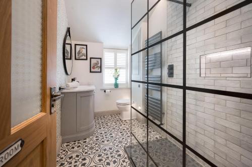 a bathroom with a toilet and a sink at Townhouse by Harrogate Serviced Apartments in Harrogate