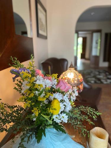 a bouquet of flowers sitting on a table at Las Casonas de Avellaneda in Navia