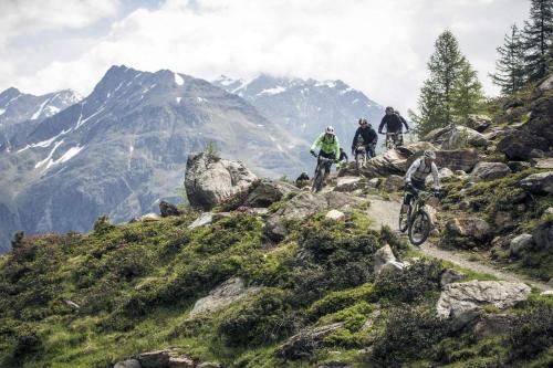 a group of people riding bikes on a mountain trail at Pension Wendlhof in Obergurgl