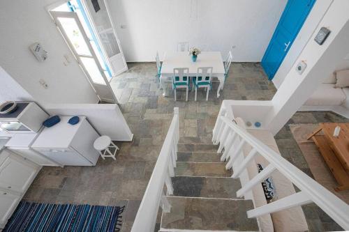 a room with a table and a dining room at White Pearl Villa Kalymnos - 2bdr & Private Pool in Kalymnos