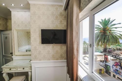 Porto Eda Hotelにあるテレビまたはエンターテインメントセンター