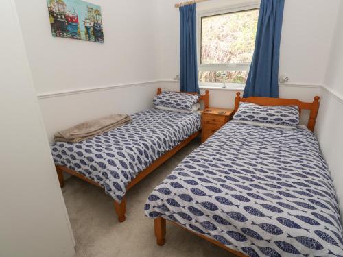 Voodi või voodid majutusasutuse Badger Sett in Granite Henge near Looe toas