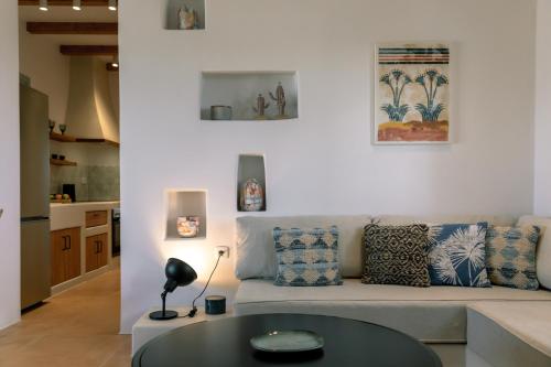 a living room with a couch and a table at Ambeli Sunset Villas in Megalokhori