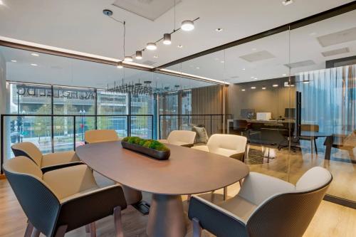 a dining room with a table and chairs at AC Hotel by Marriott Washington DC Convention Center in Washington