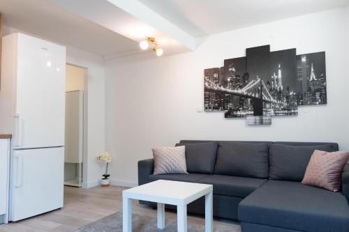 a living room with a couch and a table at Central Moon Apartment no.1 in Split
