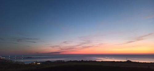 a sunset over the ocean with the sky at Alby suite in Termoli