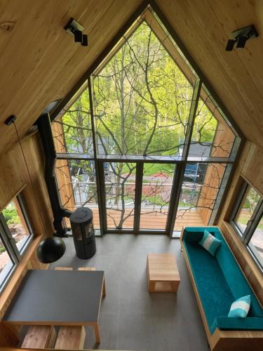 an overhead view of a room with a large window at Baumwipfelhaus in Annweiler am Trifels