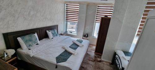 Postel nebo postele na pokoji v ubytování Raqeem Hotel