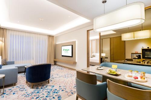a large living room with a dining and living room at Holiday Inn Lucknow Airport by IHG in Lucknow
