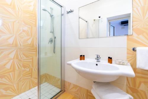 Koupelna v ubytování Hotel Tirsus