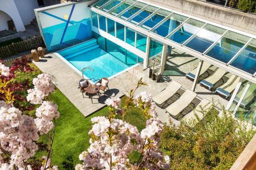 an overhead view of a house with a swimming pool at Residence Landhaus Fux in Silandro