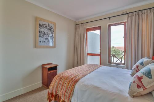 Ένα ή περισσότερα κρεβάτια σε δωμάτιο στο Rio self catering holiday apartment