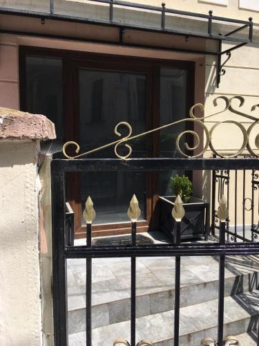 a balcony with a window with a potted plant on it at Regia Bitola in Bitola