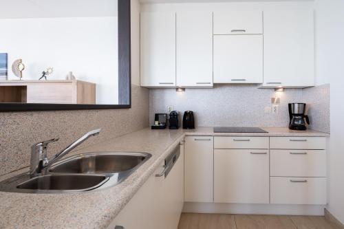Dapur atau dapur kecil di Strandappartementen De Gulden Stroom