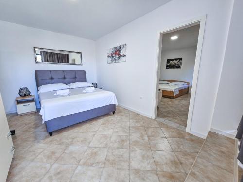 Posteľ alebo postele v izbe v ubytovaní Apartments Vuković Vanja