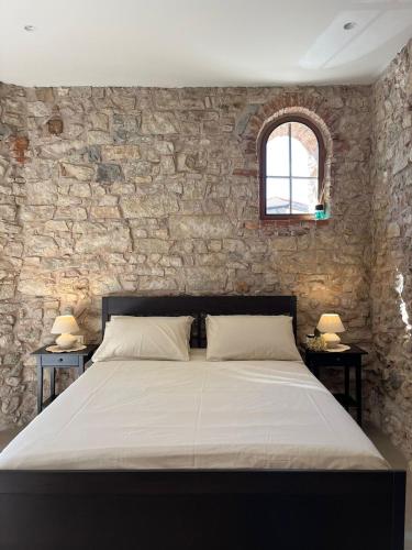 Ένα ή περισσότερα κρεβάτια σε δωμάτιο στο Casa Castello