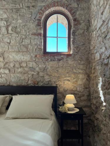 Ένα ή περισσότερα κρεβάτια σε δωμάτιο στο Casa Castello