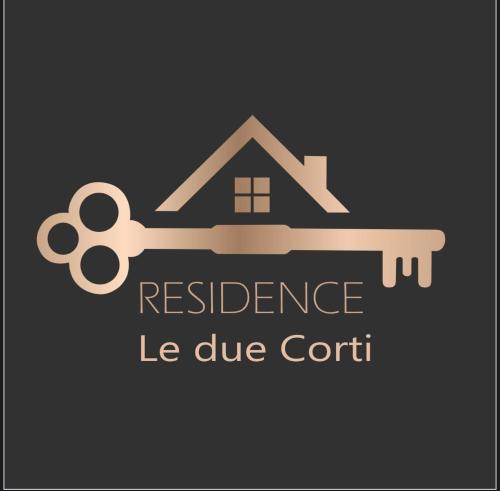 a key to a house with a residence le due cortii at Residence Le due Corti in Imola