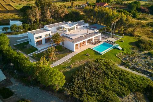 an aerial view of a house with a swimming pool at Villa Seven in Lachania