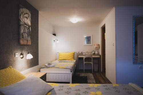 Postel nebo postele na pokoji v ubytování Soba i Apartman Đula