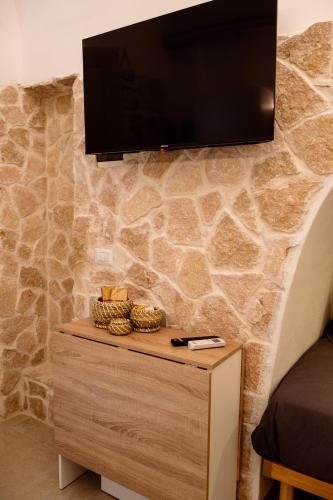 TV a/nebo společenská místnost v ubytování Nonna Vittoria Apartments