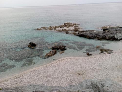 an aerial view of a beach with rocks and water at Beautiful Pelion Guesthouse with Spectacular Views in Anilio Pelion
