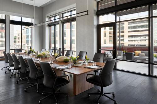 a large conference room with a long table and chairs at Marriott Owings Mills Metro Centre in Owings Mills