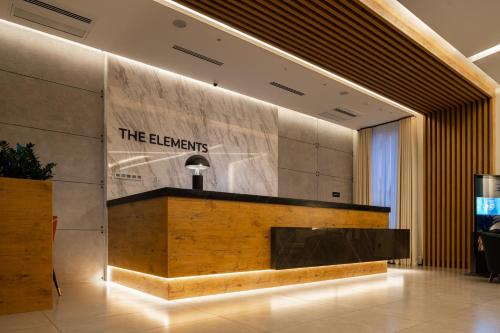 a lobby with a reception desk in a building at THE ELEMENTS HOTEL in Tashkent