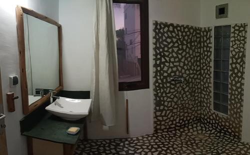 a bathroom with a sink and a toilet and a shower at Location lydie in Antananarivo