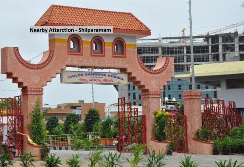 a gate with a sign in front of a building at Super Hotel O Golden Hive Madhapur Near Shilparamam in Hyderabad