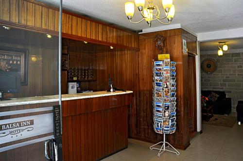 a bar in a restaurant with wood paneled walls at Casona Plaza Balsa Inn in Puno
