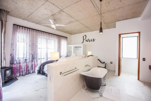 a bathroom with a sink and a toilet in a room at Yzerfontein Villa Fantastica - No Loadshedding in Yzerfontein