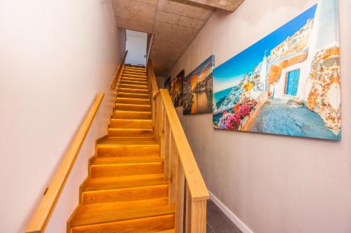 a staircase in a house with a painting on the wall at Yzerfontein Villa Fantastica - No Loadshedding in Yzerfontein
