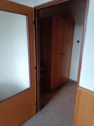 an empty room with a door and a closet at Penzion Hana in Hracholusky