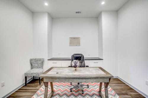 an empty room with a table and two chairs at Serene Austin Stunner in Austin