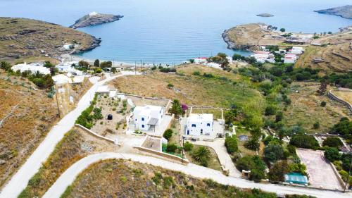 an aerial view of a house on a hill next to the ocean at SerenSea Bliss, Naousa, Kythnos in Kithnos