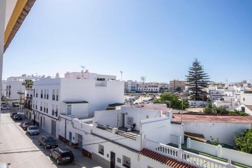 a view of a city street with buildings at La Ensenada, apartamento junto al mar in Barbate