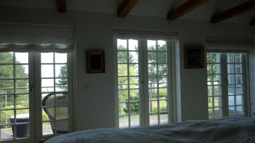 Postel nebo postele na pokoji v ubytování DENMARK SEA FRONT ENCHANTING - Beach Villa