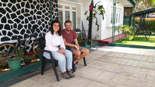 a man and a woman sitting in a chair at KPL Holiday Homes in Hatton