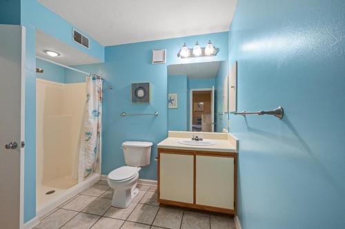 a bathroom with a toilet and a sink and a shower at Heron Pointe C8 in Myrtle Beach