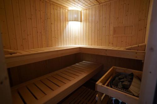 a small wooden sauna with a light in it at Drevenica Harmony in Ružomberok