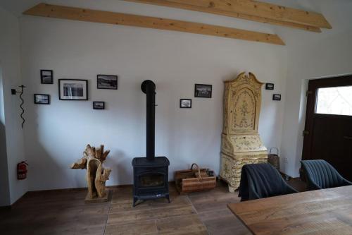 a living room with a wood stove in a room at Drevenica Harmony in Ružomberok